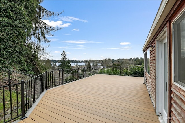 wooden deck featuring a water view