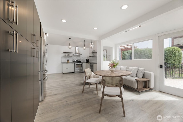 dining area with recessed lighting and light wood-type flooring