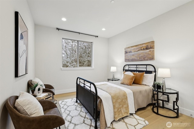 bedroom featuring recessed lighting, baseboards, and wood finished floors