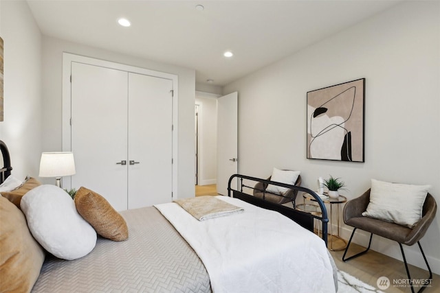 bedroom with recessed lighting and a closet