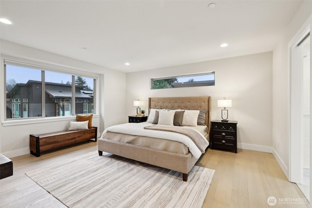 bedroom featuring light wood-style flooring, recessed lighting, and baseboards