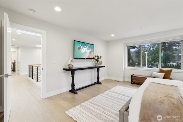 bedroom with visible vents, recessed lighting, light wood-type flooring, and baseboards