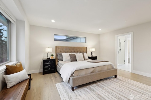 bedroom featuring recessed lighting, multiple windows, and light wood finished floors