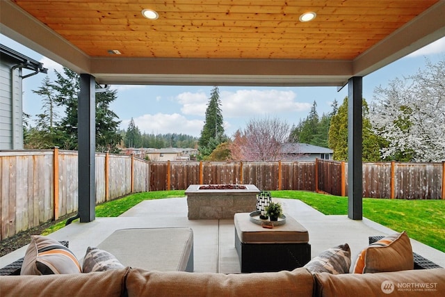 view of patio / terrace featuring an outdoor living space with a fire pit and a fenced backyard