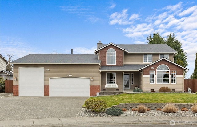 traditional-style house featuring driveway, a front lawn, fence, a garage, and a chimney