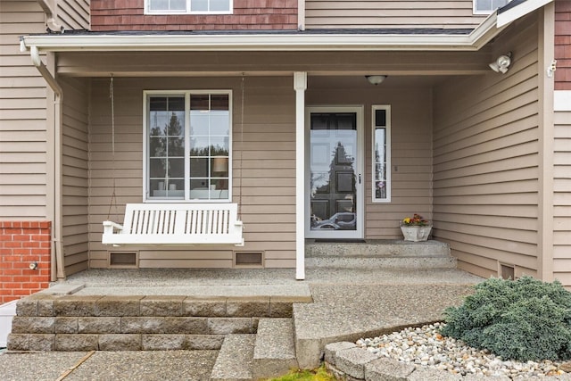 doorway to property with covered porch