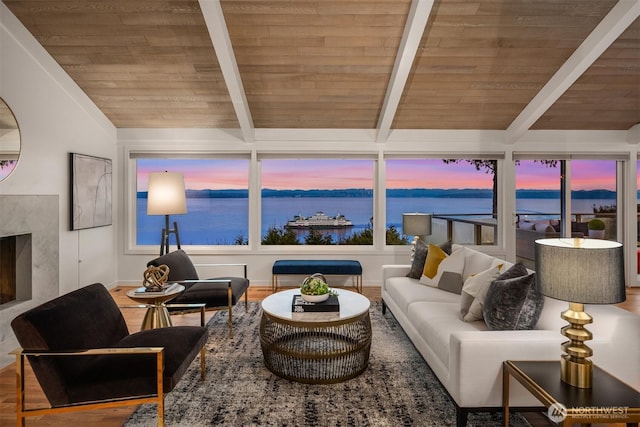 living room featuring wood finished floors, wooden ceiling, vaulted ceiling with beams, and a premium fireplace