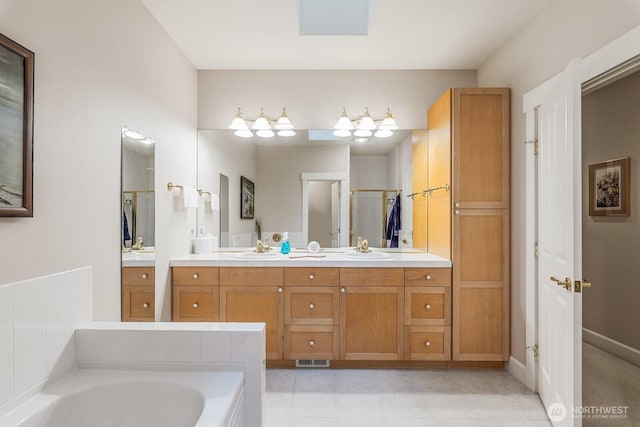 bathroom featuring a stall shower, visible vents, a bath, and vanity