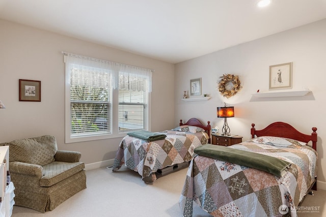 bedroom featuring carpet flooring and baseboards