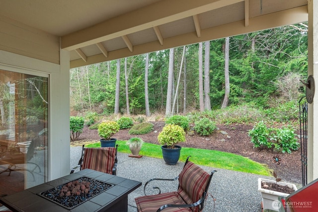 view of patio / terrace with an outdoor fire pit