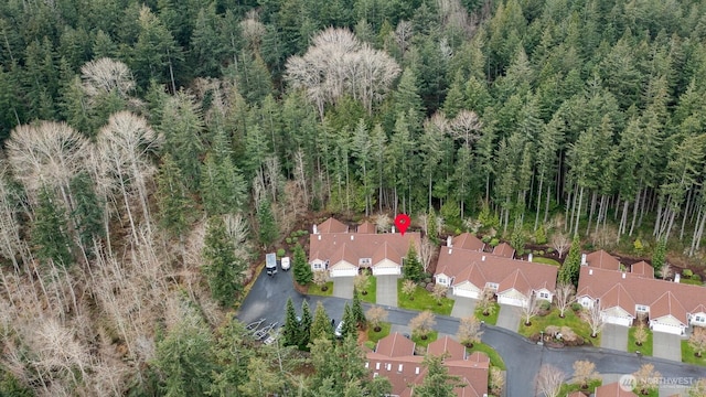 aerial view featuring a residential view and a forest view