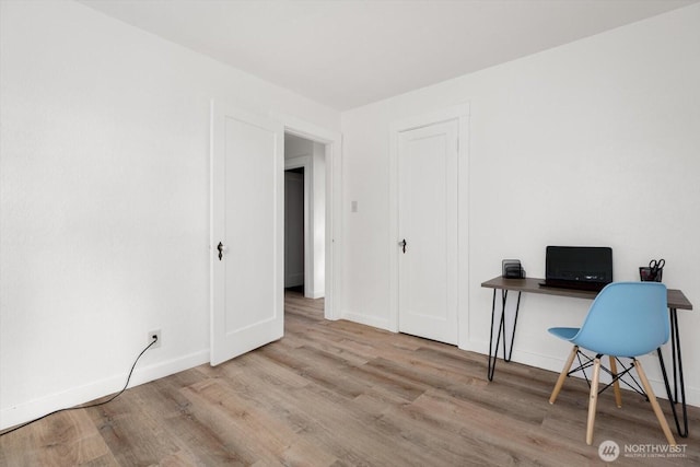 office featuring baseboards and wood finished floors