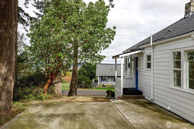 view of yard featuring entry steps and a patio