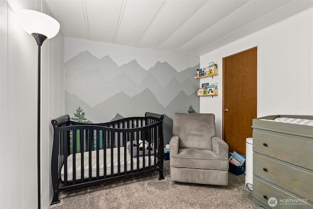 carpeted bedroom with a crib