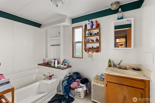 full bathroom with a bath and vanity