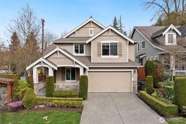 craftsman-style house featuring a garage, a porch, stone siding, a shingled roof, and concrete driveway