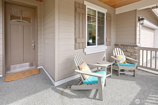 exterior space featuring a porch and a garage