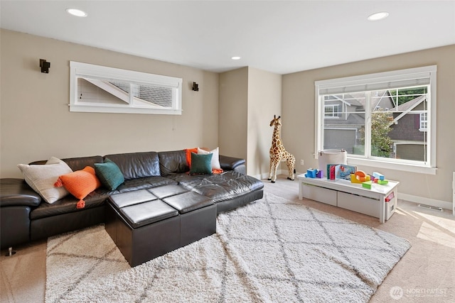 carpeted living room with baseboards and recessed lighting