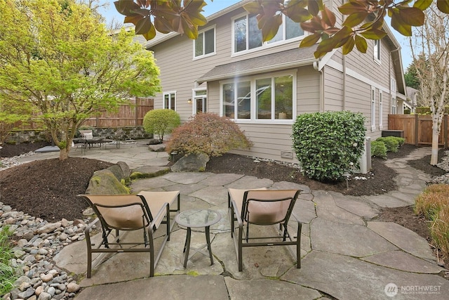 view of patio featuring fence