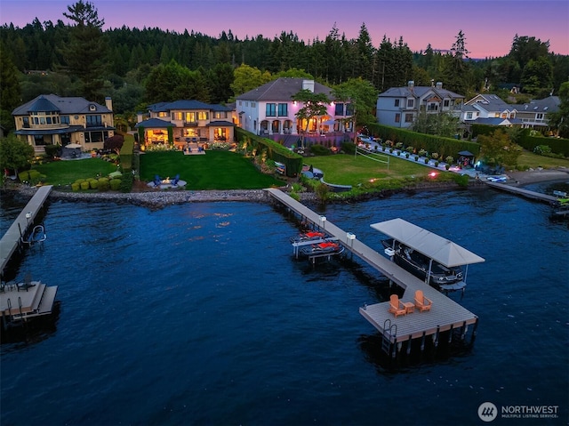 aerial view at dusk with a water view