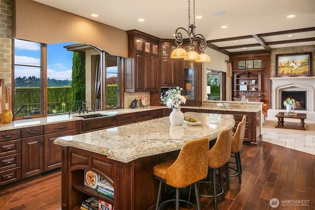 253 E Lake Sammamish Pkwy SE, Sammamish, WA 98074 - kitchen featuring glass insert cabinets, a kitchen island, a peninsula, and dark wood-style floors