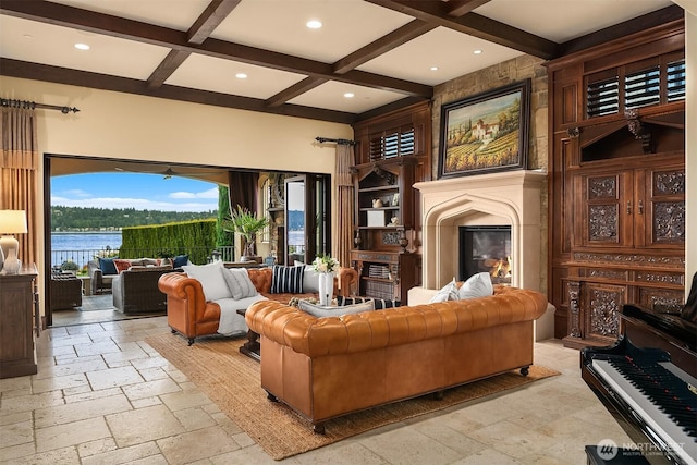 253 E Lake Sammamish Pkwy SE, Sammamish, WA 98074 - living room featuring a large fireplace, stone tile flooring, beam ceiling, coffered ceiling, and a water view