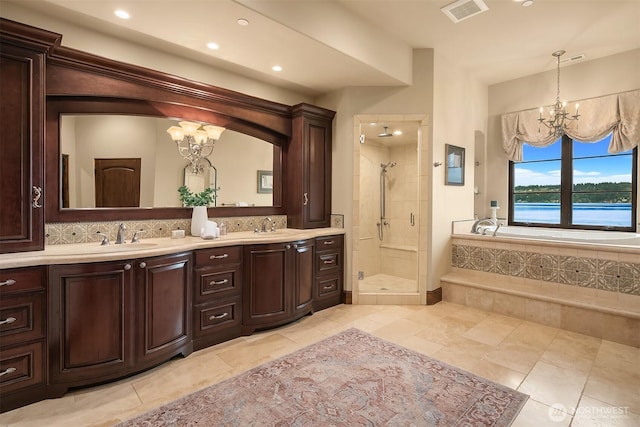 253 E Lake Sammamish Pkwy SE, Sammamish, WA 98074 - full bath featuring a shower stall, visible vents, a sink, and an inviting chandelier