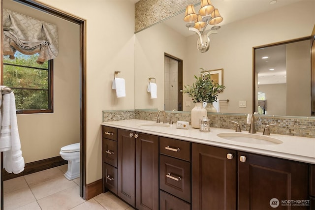 253 E Lake Sammamish Pkwy SE, Sammamish, WA 98074 - full bath with a sink, tile patterned floors, tasteful backsplash, and an inviting chandelier
