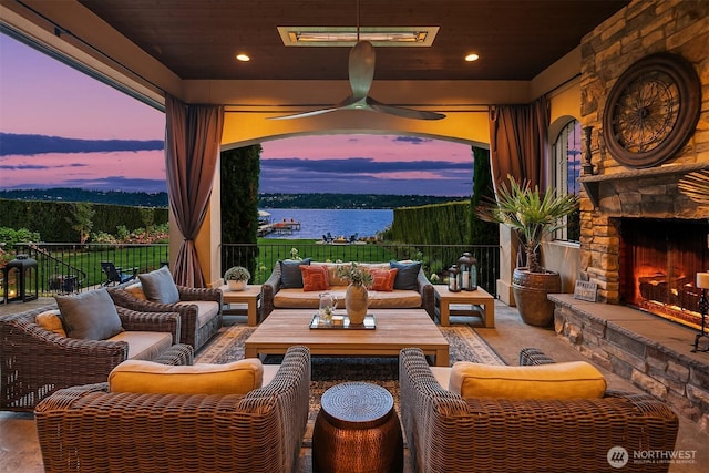 253 E Lake Sammamish Pkwy SE, Sammamish, WA 98074 - view of patio with a water view, an outdoor living space with a fireplace, and ceiling fan