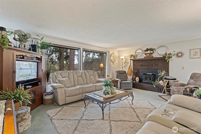 carpeted living area with a textured ceiling