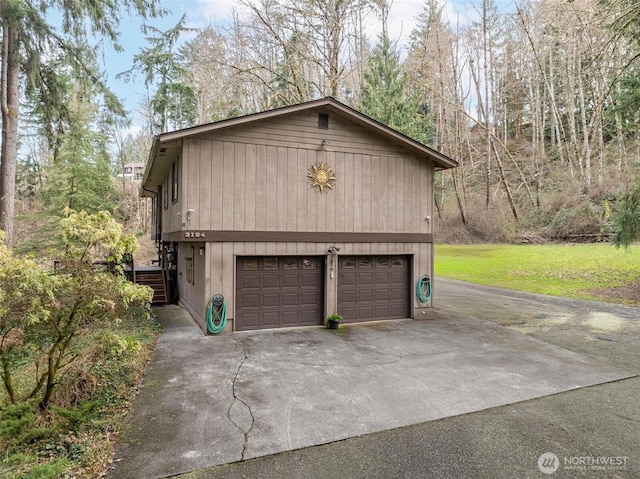 garage with concrete driveway