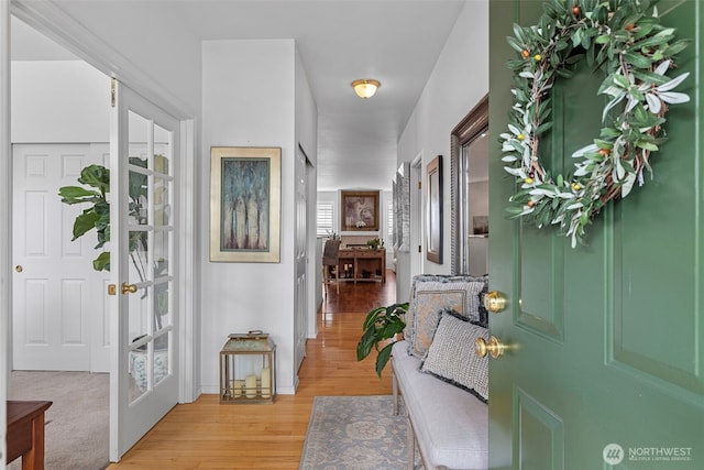 foyer entrance featuring light wood-style floors