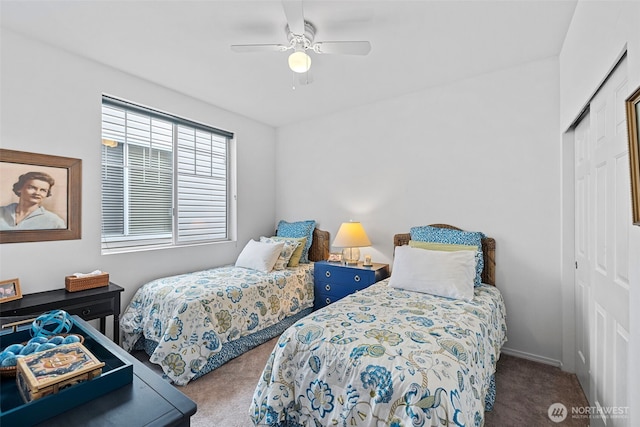 carpeted bedroom with a closet, baseboards, and ceiling fan