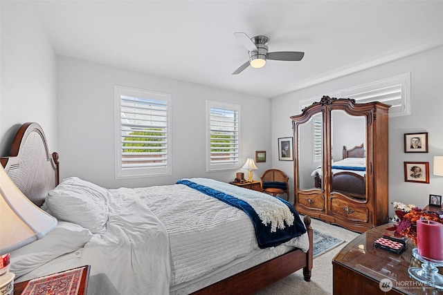 carpeted bedroom with a ceiling fan