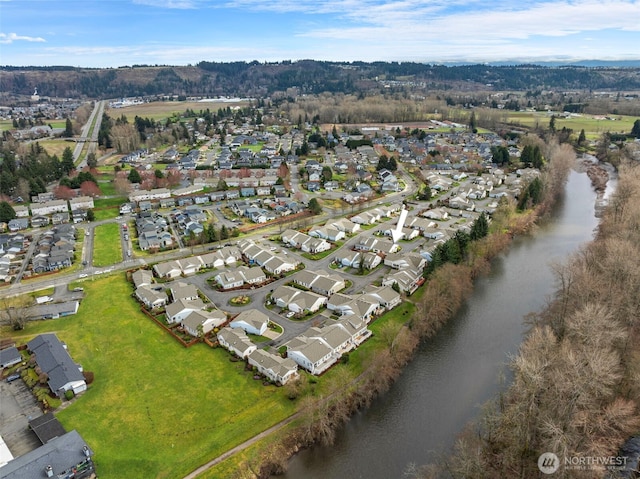 birds eye view of property with a residential view and a water view