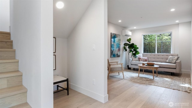 staircase featuring a wall unit AC, recessed lighting, wood finished floors, and baseboards