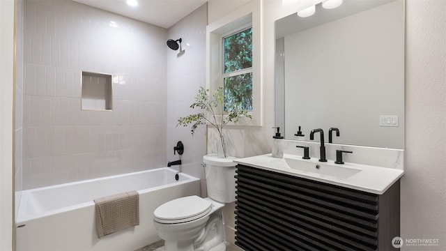 full bath with toilet, vanity, and  shower combination