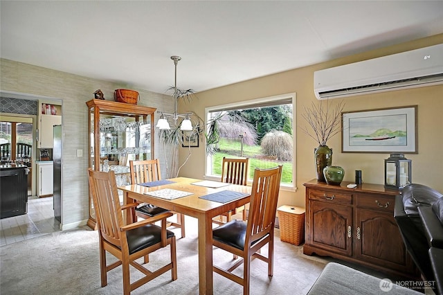 dining area with light colored carpet, a wall unit AC, and an inviting chandelier