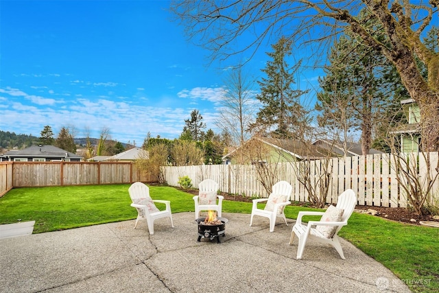 view of patio with a fenced backyard and an outdoor fire pit