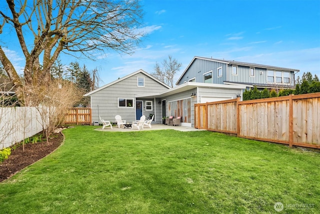 back of house featuring a yard, a fenced backyard, and a patio