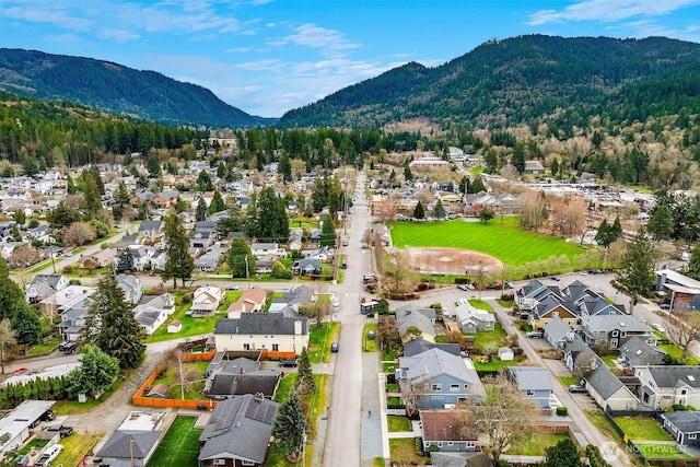 birds eye view of property featuring a mountain view and a residential view