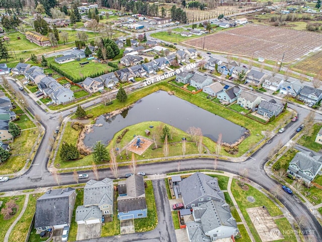 aerial view featuring a water view and a residential view