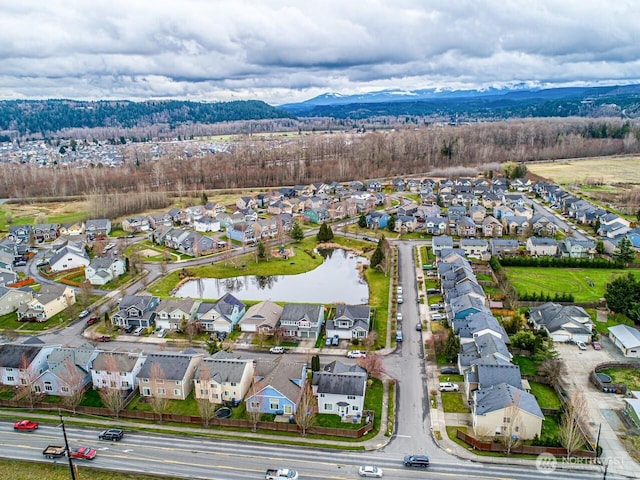 aerial view featuring a residential view and a water and mountain view