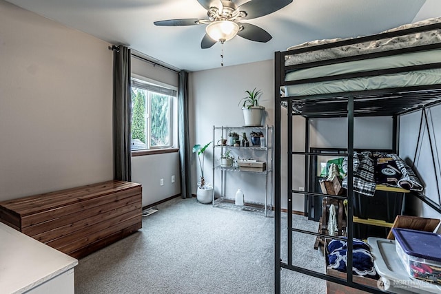 bedroom featuring ceiling fan, baseboards, and carpet floors