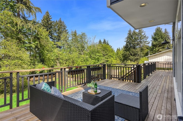 wooden deck featuring an outdoor hangout area