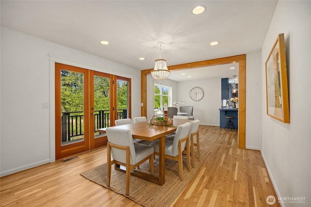 dining space featuring recessed lighting, baseboards, and light wood finished floors