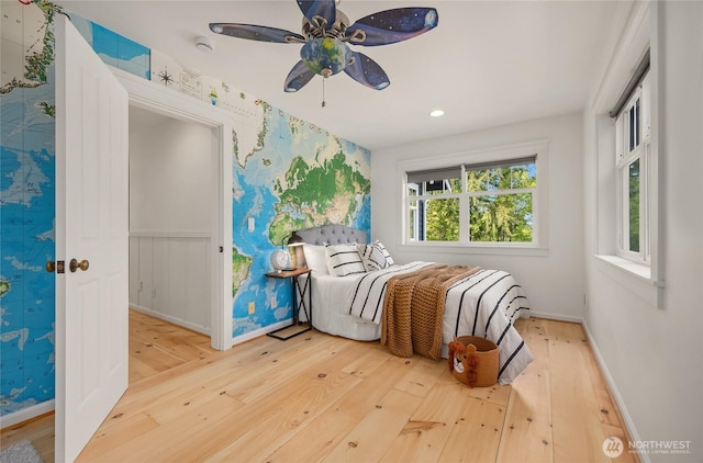 bedroom with wood-type flooring, recessed lighting, and baseboards
