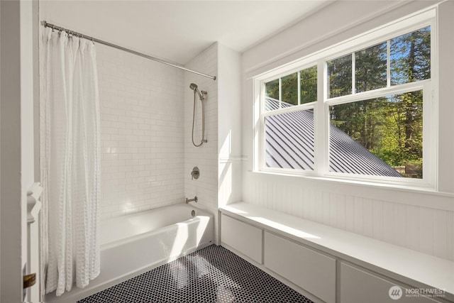 full bath featuring tile patterned flooring and shower / bath combo