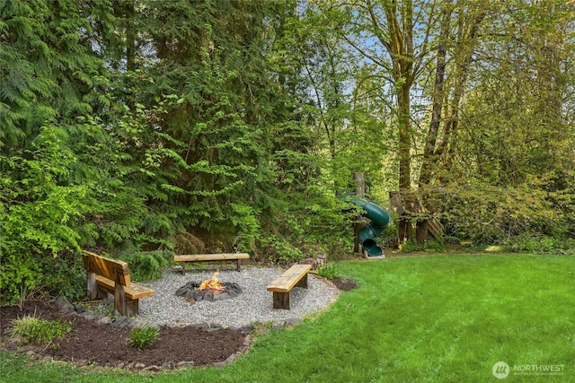 view of yard featuring a fire pit