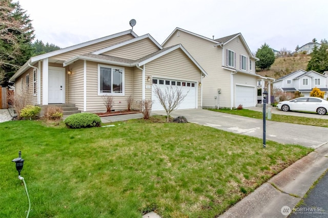 view of front of home featuring a garage, a front yard, and driveway